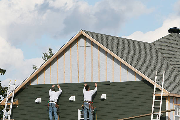 Professional Siding technician working in Huron, OH